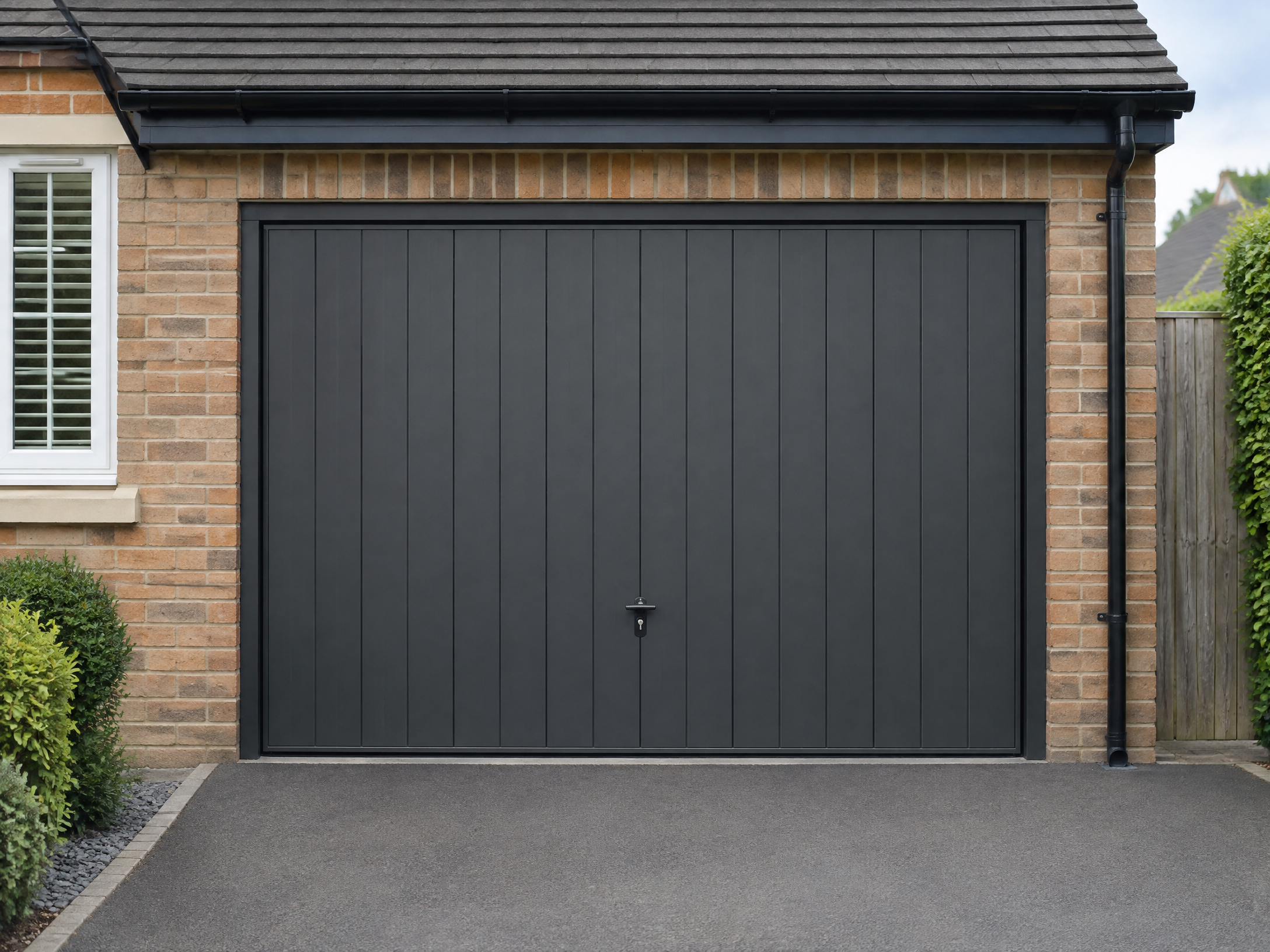 Up-and-over garage door installed on a property